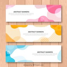 three abstract banners on wooden background with dots and circles in different colors, shapes and sizes