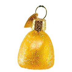 a yellow bell ornament hanging from a metal hook on a white background with gold flecks