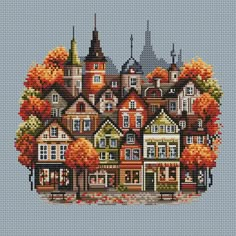 a cross stitch pattern with houses and trees in the fall colors on a blue background