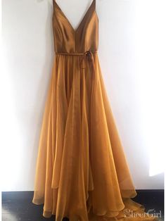 Gold chiffon prom dress with satin top. It can be made in other colors, please contact us 1.Silhouette:A Line 2.Fabric:Chiffon 3.Embellishment:Sash 4.Neckline:V Neck 5.Sleeve:Sleeveless 6.Waistline:Natural 7.Hem-length:Sweep Train 8.Back Details:Zipper 9.Fully Lined:Yes 10.Buit-In Bra:Yes 11.Boning:Yes 12.Picture Color:Gold Simple Prom Dress Long, Leanne Marshall, Cheap Prom Dresses Long, Evening Dress Long, V Neck Prom Dresses, Floor Length Prom Dresses, Long Prom Dresses, Beauty Dress, Sweet 16 Dresses