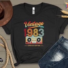 1983 Vintage Shirt, 1983 Birthday Shirt, 41th Birthday Gift, 40th Birthday Tshirt, 1983 Vintage Tee, 1983 Retro Shirt, Vintage Birthday Gift Thank you for visiting our Shop The brand of t-shirts are Bella Canvas and Gildan It is possible to put any design on t-shirts and sweatshirts. Just send us your photo or design PRODUCT DESCRIPTION Solid colors are 100% combed and ring-spun cotton Heather colors are 52% combed and ring-spun cotton, 48% polyester HOW TO ORDER Check and review all photos Select your model-size and color from dropdown menus Choose your quantity Leave your note on personalization box(if need be) Click ADD TO CART and PROCEED TO CHECK OUT Note: There may be more than one product in the picture. Prices are valid for one product only HOW TO CARE DO Inside out before wash DO 1983 Birthday, Blessed Mama Shirt, Girls Thanksgiving Outfit, Momma Shirts, Airbrush T Shirts, Sassy Shirts, 40th Birthday Shirts, Birthday Tshirts