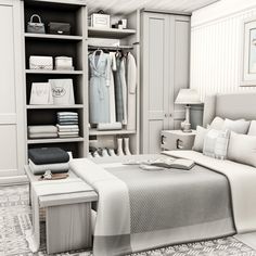 a bed sitting in a bedroom next to a closet filled with white furniture and lots of drawers