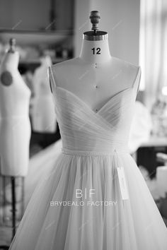 black and white photo of dress on mannequin