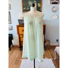 "Vintage Small Seafoam Green Nightie Small Sears 32-34 60's pastel pistachio green sleeveless nightgown, size small. In excellent vintage condition, no stains, holes or flaws. This this is a pale lime green not aqua color.   Details: Solid lining with sheer chiffon outer layer , white cotton crochet lace around the neckline, silk collar . Made in USA   Flat approximate measurements: Sears 32-34 32\" Length 20\" Pit to Pit (stretchy) Material: Nylon" Green Spring Sleepwear For Bedtime, Green Spring Sleepwear For Sleepover, Green Sleepwear For Spring Sleepover, Green Sleeveless Summer Sleepwear, Green Sleeveless Sleepwear For Summer, Sheer Spring Sleepwear, Green Summer Nightgown For Sleepover, Flowy Sleeveless Sleepwear For Loungewear, Sheer Spring Nightgown For Bedtime