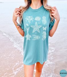 Discover our Sea Animals Comfort Colors summer beach vacation shirt! This trendy Beach t-shirt features an eye-catching Mandala graphic design that is sure to enhance your next beach vacation! Made of 100% ring-spun ethically grown cotton, this shirt is super soft and comfortable. It has a relaxed fit which is made of a medium fabric that is preshrunk. Looks super cute with shorts, jeans or as an oversized beach cover up. Great gift for a Beach Lover! Comes in 13 pretty colors! ♦️Please message Ocean Tshirt, Summer Beach Vacation, Trendy Beach, Beach Gifts, Ocean Inspired, Beach T Shirts, Comfort Wear, Vacation Shirts, Ocean Inspiration