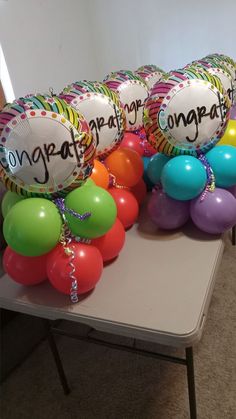 balloons and confetti are arranged on a table