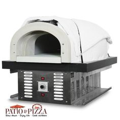 an outdoor pizza oven with a white cover over it's front and side doors