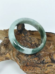 "Apple and Emerald Green Authentic Untreated Burmese Grade A Jadeite Bangle. This bangle is rounded and polished on the inside and outside. It has a consistent smooth surface with vibrant colors throughout. Code: MOJ0200 Inside Diameter: 58.2 mm Outside Diameter: 75.6 mm Bangle Width: 14.6 mm Weight: 70 grams Color: Apple and Emerald Green Transparency: Translucent Size: Medium Origin: Myanmar, Burma *Note: (If you have questions in regards to your wrist size please message us and we would be gl Green Princess, Jade Bangle, Lavender Blue, Jade Bracelet, Jade Jewelry, Shades Of White, Green Jade, Burmese, Jade Green