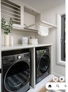 a washer and dryer in a small room