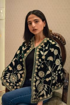 Complement your outfit with this Velvet PonchoCape. This is very easy to style cape and it can be paired with any top, blouse, dress, or any other thing, no doubt you'll stand out from the crowd.Product Details- Condition: Brand New - Handmade- Style: Cape Poncho- Fabric: Velvet - Embroidery: Kashmiri Zari Work- Fully Lined from Inside- Length: 20" (51 cms, can be customized)- Base Colour: Bottle Green (can be customized)- Embroidery Color: Gold- Care Instructions: Dry Clean Only.Sizing- Please Wedding Cape Dupatta For Eid, Bohemian Kaftan With Floral Embroidery For Wedding, Wedding Dupatta With Zari Work In Cape Shape, Elegant Embroidered Cape Dupatta, Elegant Embroidered Cape-style Dupatta, Traditional Chikankari Embroidered Dupatta, Traditional Chikankari Embroidery Dupatta With Cape Sleeves, Traditional Dupatta With Chikankari Embroidery And Cape Sleeves, Traditional Cape Dupatta For Wedding