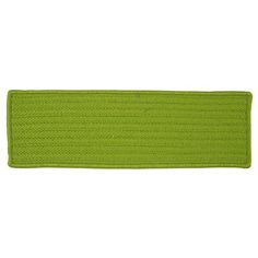 a bright green rug is shown on a white background and it has a long, narrow strip