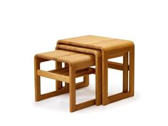 two wooden stools sitting next to each other