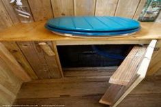 a blue plate sitting on top of a wooden table