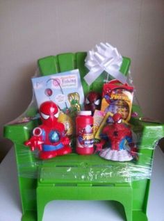 a green plastic chair with toys and other items in it on top of a table