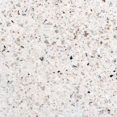 an image of a white marble counter top textured with black and grey speckles