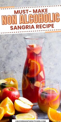 a pitcher filled with liquid next to sliced oranges and apples