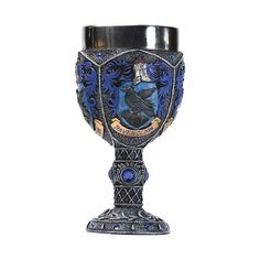 an ornate blue glass vase is shown on a white background