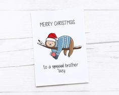 a christmas card with a monkey wearing a sweater and hat on it's back