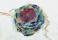 a bird nest made out of many different types of sticks and thread on a white surface