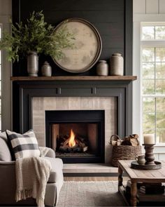 a living room filled with furniture and a fire place in the middle of the room