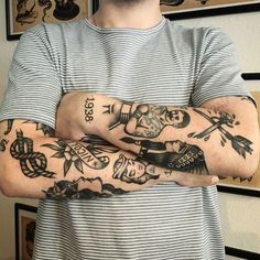 a man with many tattoos on his arms