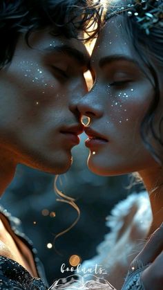 two people kissing each other with their faces covered in white powder and sparkles on them