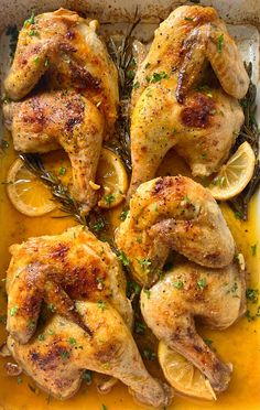 chicken with lemons and herbs in a baking dish