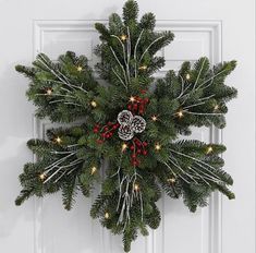 a christmas wreath hanging on the front door