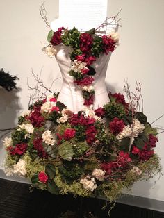 a dress made out of flowers on display