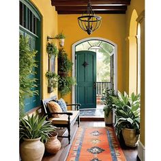 an entryway with potted plants and a green door on the right side is decorated with greenery