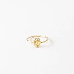 "Here comes the sun! Add this small sunbeam ring to your stack for a daily dose of sunshine.  Every piece is handcrafted and hand-personalized with love in La Conner, WA, using 90% recycled and 100% ethically sourced raw materials from the USA--because it's better that way. Includes free gift-ready packaging (featuring a care card and traditional letterpress goodies made by my dad)!  MATERIALS: * Gold = 14k gold filled * Silver = sterling silver DETAILS: * 8x6mm oval * Hand-personalized with traditional metal punches AT CHECKOUT: * If you chose \"other\" for size, specify which ring size you'd like in a note. * Select expedited shipping (and add a note with your ideal delivery date) if you need your piece sooner than our standard production time. GIFT NOTES: * At checkout, check the box if Starburst Ring, Sunburst Ring, Sun Design, Oval Ring, Oval Rings, Personalized Rings, Classic Ring, Ring Finger, Jewelry Inspo