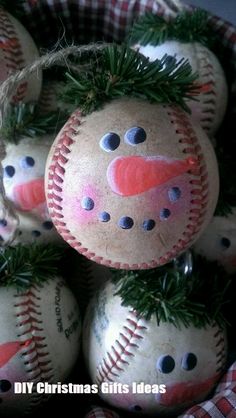 some baseballs that have been decorated to look like snowmen