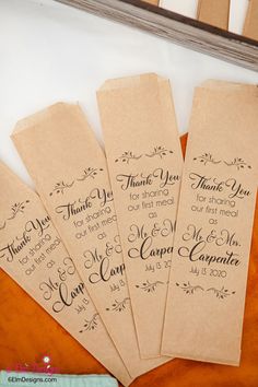 some brown paper tags with writing on them