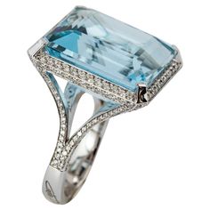 "Costis" Aquamarine Ring with 29.42 carats Aquamarine and Diamonds A simple, yet elegant setting to celebrate remarkable aquamarines. Every design is a challenge, starting from the highly demanding three-dimensional pieces, to the ostensibly simplest settings. Costis actually believes that what seems to be simple in appearance is the hardest to achieve. This does not mean less hours in the design room and in the workshop, but instead respect to the quality and value of the central gemstones. 18K White Gold. The ring features a 29.42 carats central stone surrounded with a total of 1.55 carats of Diamonds. Aquamarines remind Costis the hues of the Greek surroundings... the sea, the sky, the horizon... characteristics that he always uses in his pieces. Design Room, Aquamarine Ring, Aqua Marine, Aquamarine Rings, The Horizon, Cocktail Rings, Three Dimensional, Aquamarine, Diamond Ring