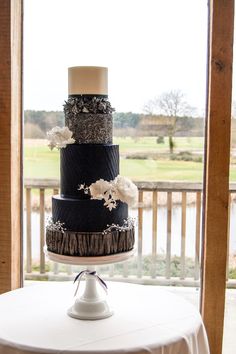 a three tiered cake sitting on top of a table