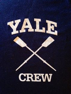 an embroidered shirt with two crossed oars and the word yale crew on it