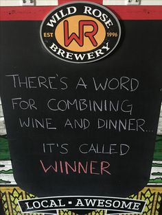 a sign that says there's a word for combining wine and dinner it's called winner