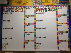 a bulletin board with words written in different colors and shapes on it, along with other writing materials