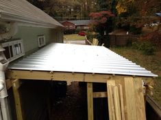 a metal roof on the side of a house