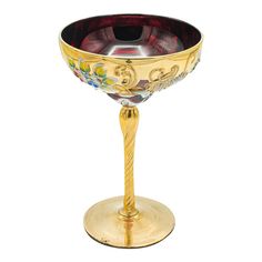 an ornately decorated goblet sits on a stand