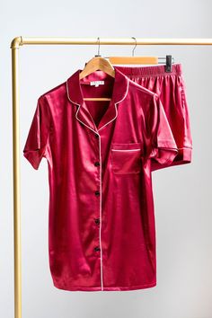 These ruby red satin pyjamas are perfect for lounging around and enjoying time at home! This luxurious two-piece pyjama set contains our signature white trim piping in a rich red satin colour. It includes both a short sleeve top with a traditional collar and pocket, and a pair of matching shorts with our elasticized waistband. Matching sets are available for pets! Silky Pajamas, Red Pajamas, Pyjama Satin, Matching Pjs, Adult Pajamas, Pyjama Sets, Brand Magazine, Stocking Fillers For Her, Nightwear Women