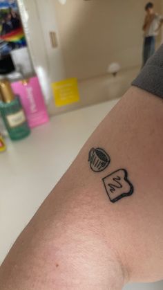 a person with a small tattoo on their arm