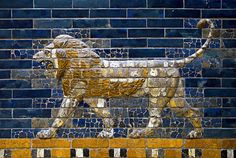 a close up of a brick wall with a lion on it