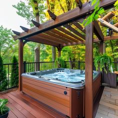 a hot tub sitting on top of a wooden deck