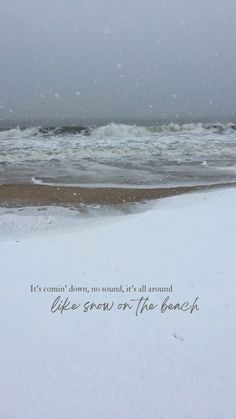 an ocean view with the words, it's snowing now, it's all around