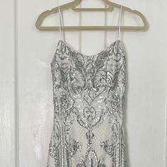 White And Silver Beaded Floor Length Prom Dress With Slit White Silver Prom Dress, White And Silver Prom Dress, Silver Prom Dress Sparkly, Prom Dresses Long White, Iridescent Prom Dress, Adam Silver, Hoco Inspo, Black Lace Evening Dress, Black Lace Wedding