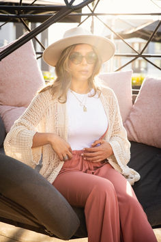 Our Crochet Netted Cardigan- Cream opens up endless style possibilities. Made of an oversized lightweight fabric, this cardigan provides a comfortable fit and a timeless look that will never go out of style. Perfect for layering over any look, day or night. Lightweight Casual Summer Outerwear, Casual Lightweight Summer Outerwear, Open Knit Cardigan For Loungewear, Open Knit Cardigan For Fall Loungewear, Open Knit Relaxed Fit Cardigan For Layering, Relaxed Fit Open Knit Cardigan For Layering, Relaxed Fit Open Knit Cardigan For Fall, Slouchy Cozy Cardigan For Spring, Lightweight Long Sleeve Cardigan For Layering