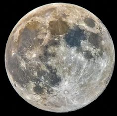 the full moon is shown in black and white