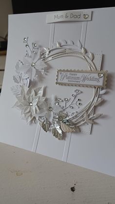 a close up of a greeting card with flowers and leaves on the inside of it