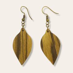 Our natural earthy zebrawood teardrop earrings are a classic shape and perfect for everyday wear or for a special evening out. We love the way the wood grain brings warmth and texture to this simple design. They're lightweight and dangle from brass earring hooks that keep them in place. Length: 2 1/2 inches with ear wires Materials: Reclaimed zebrawood, brass ear wires Handmade Natural Wood Teardrop Jewelry, Bohemian Brown Teardrop Earrings, Wood Teardrop Earrings, Brown Teardrop Wood Jewelry, Artisan Brown Wooden Earrings, Bohemian Brown Leaf-shaped Earrings, Zebra Wood, Brass Earrings, Teardrop Earrings